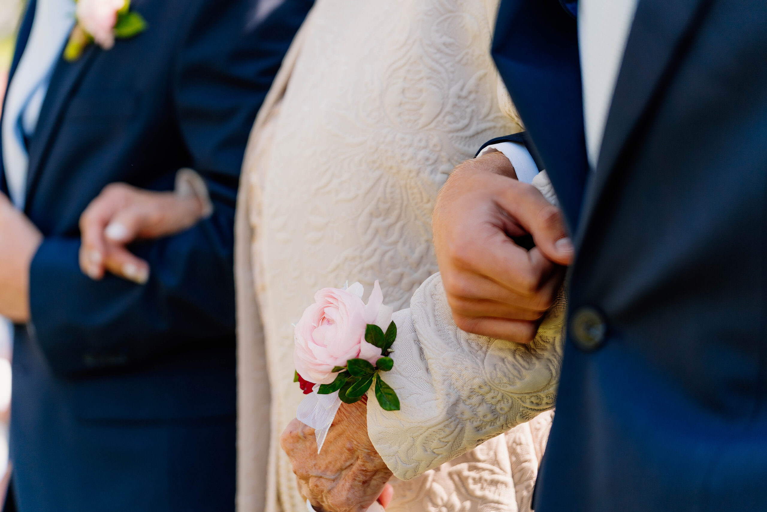 Wrist corsage close-up with white florals