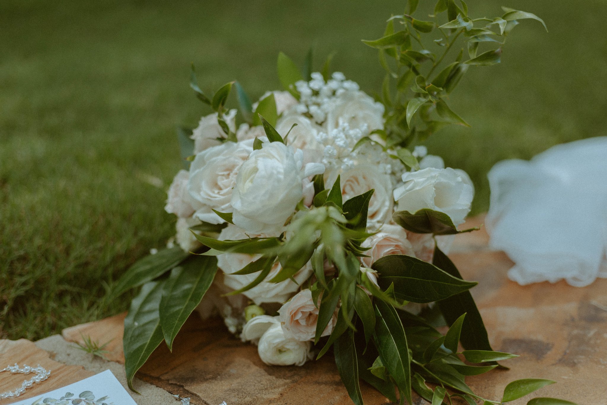 Grandmother being escorted down the aisle at an outdoor wedding