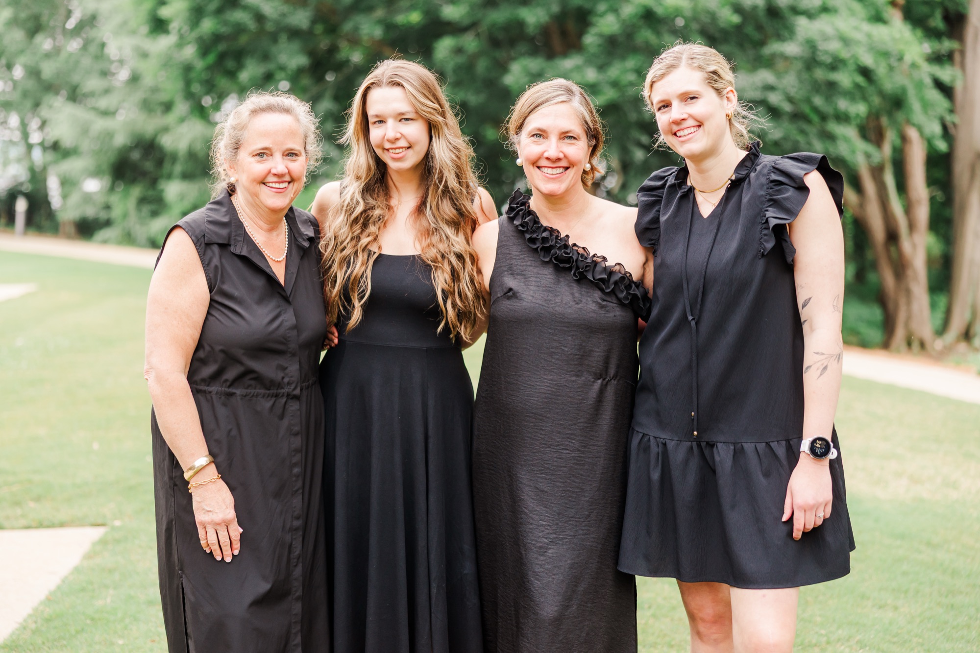 The Poppies and Peonies team outdoors together after a Clemson wedding
