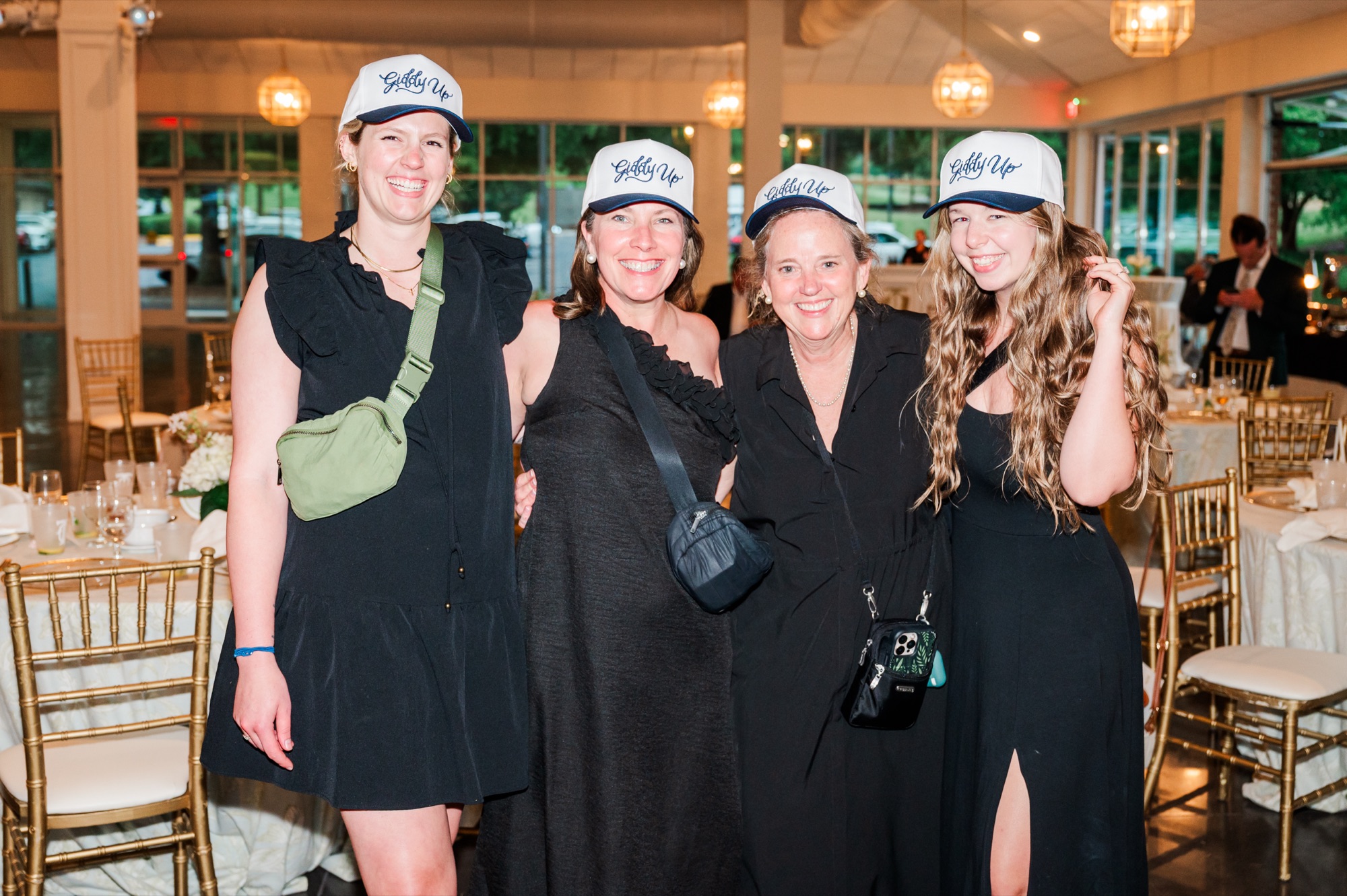 The Poppies and Peonies team celebrating together at a wedding reception