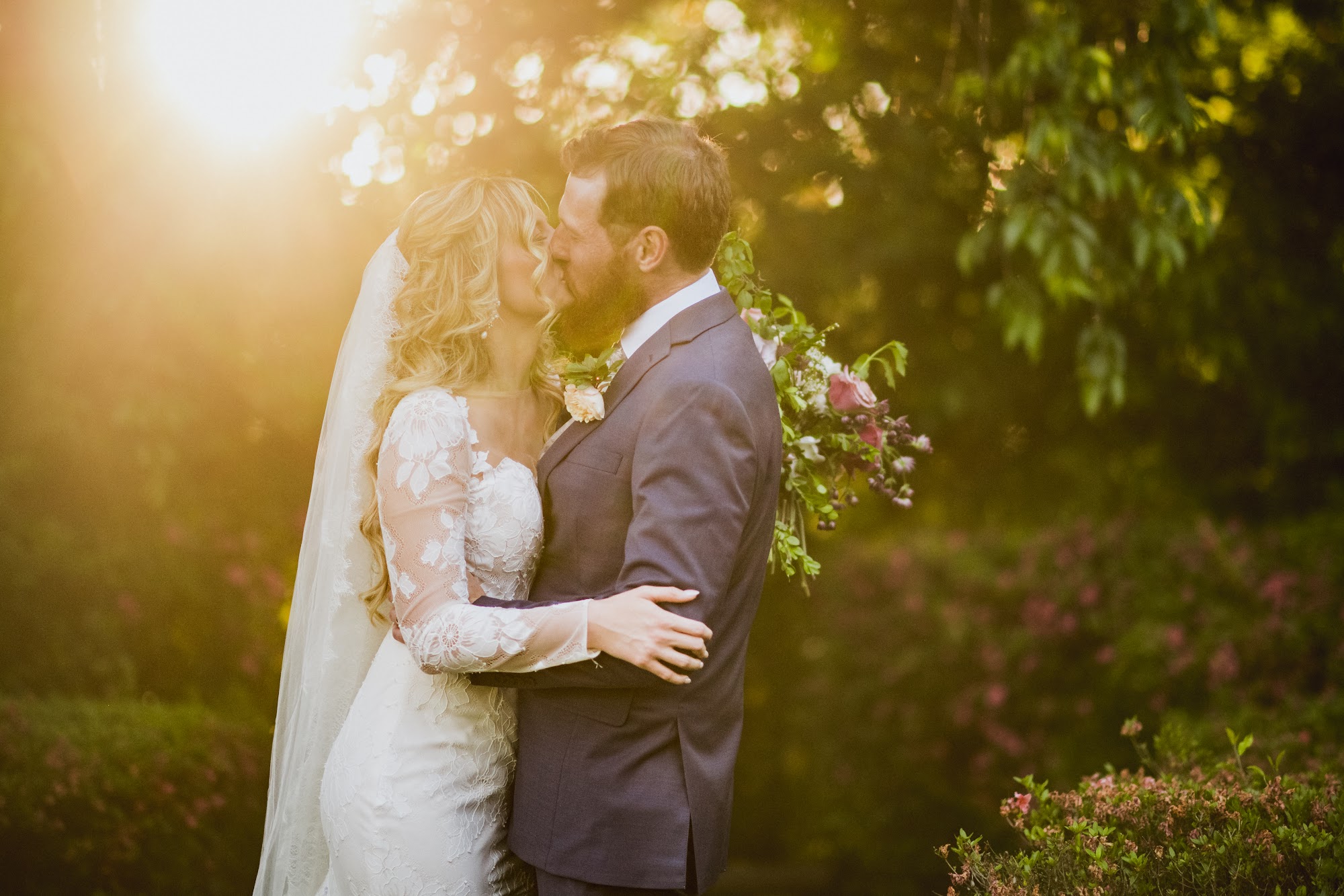 Couple in the Anderson University garden at golden hour