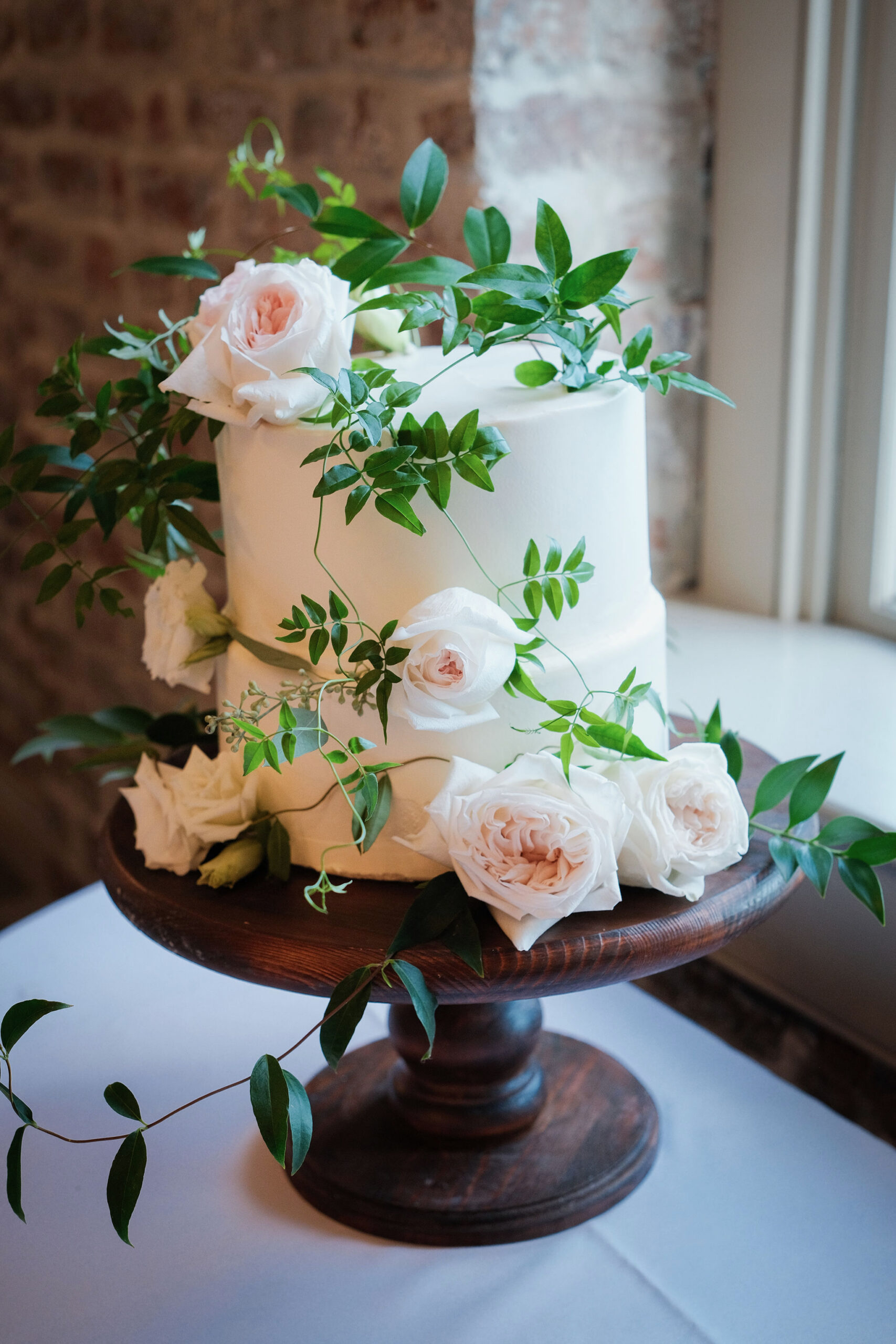 Cascading blooms on wedding cake