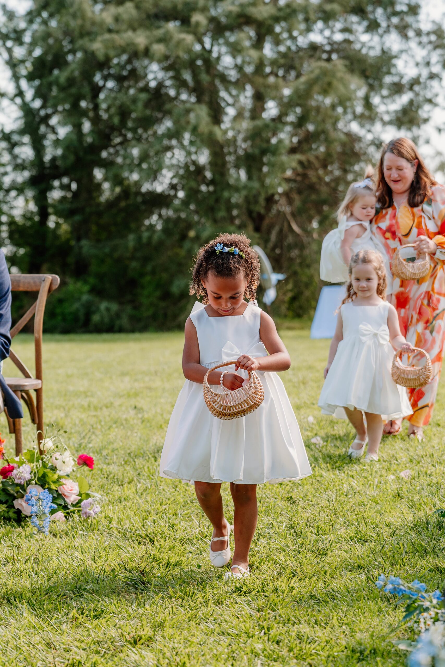 Flower girls walking down aisle