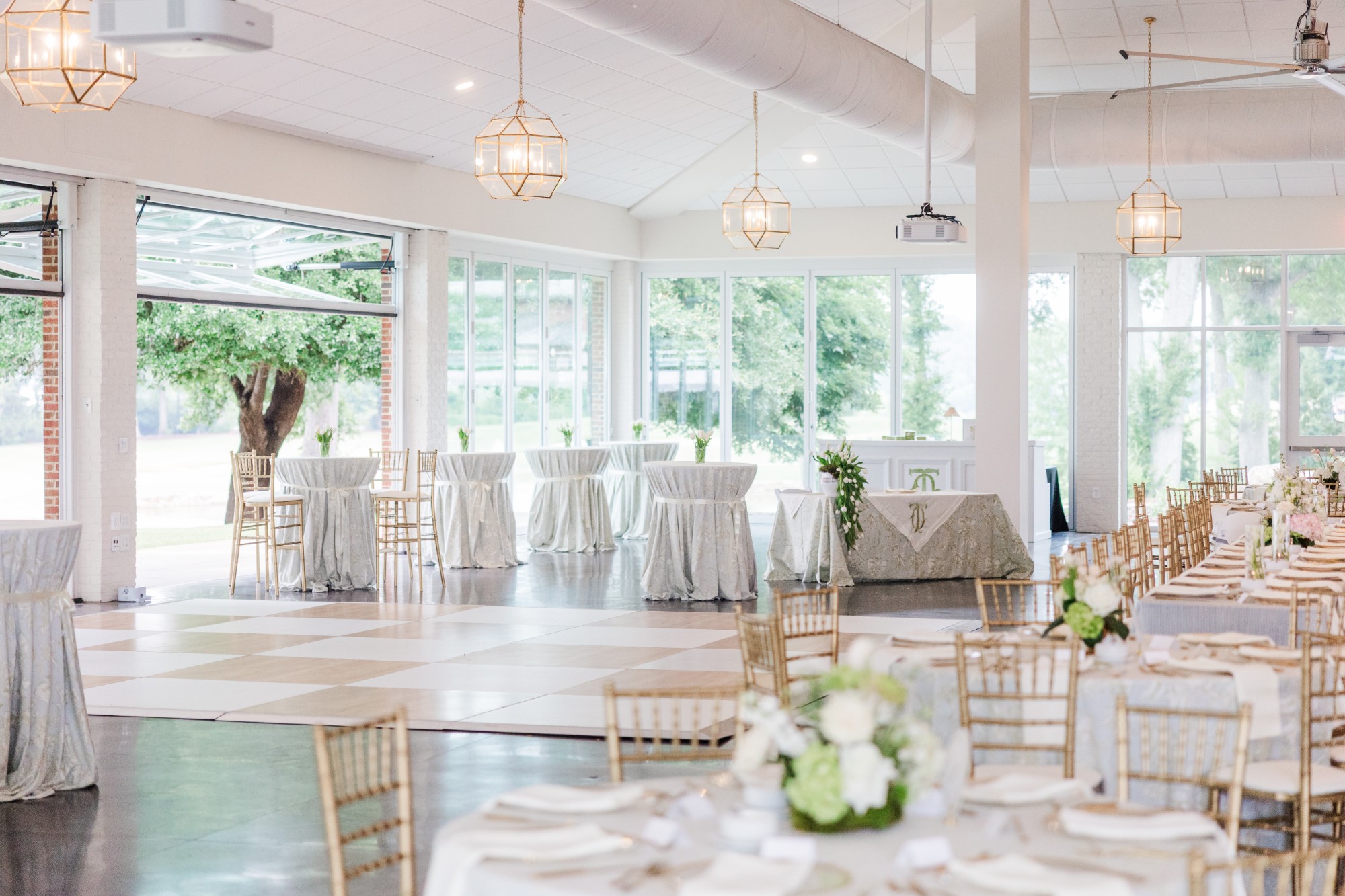 Elegant reception hall with pendant lighting and dance floor
