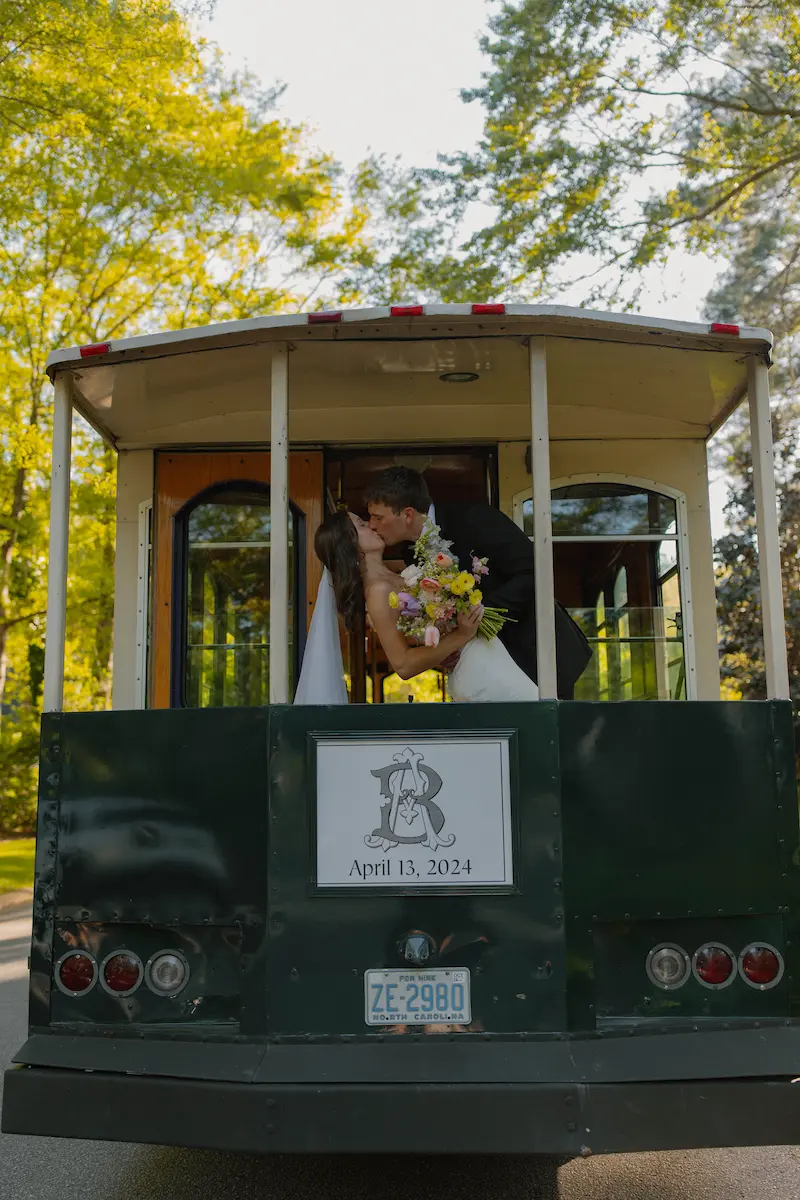 bridge and groom kiss in trolley